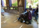 Wheelchair visitors are waiting for someone to lead them in