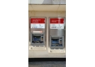 ATMs of different heights in the bank of the Main Street